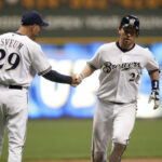 May 2, 2006; Milwaukee, WI, USA; Milwaukee Brewers catcher #26 Damian Miller is congratulated by third base coach #29 Dale Sveum after hitting a home run during the seventh inning against the Houston Astros at Miller Park. Mandatory Credit: Photo By Jeff Hanisch-USA TODAY Sports Copyright (c) 2006 Jeff Hanisch. Credit: IMAGN IMAGES via Reuters Connect