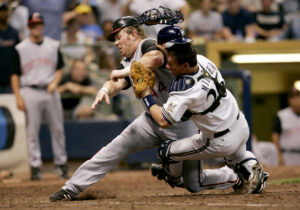 July 28, 2006; Milwaukee, WI, USA; Cincinnati Reds left fielder #44 Adam Dunn collides with Milwaukee Brewers catcher #26 Damian Miller during the sixth inning at Miller Park. Dunn was tagged out on the play to end the inning. Mandatory Credit: Photo By Jeff Hanisch-USA TODAY Sports Copyright (c) 2006 Jeff Hanisch. Credit: IMAGN IMAGES via Reuters Connect