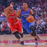 Nov 5, 2015; Chicago, IL, USA; Oklahoma City Thunder guard Russell Westbrook (0) dribbles the ball past Chicago Bulls guard Derrick Rose (1) during the first half at the United Center. Mandatory Credit: Dennis Wierzbicki-USA TODAY Sports
