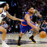 Mar 10, 2025; Sacramento, California, USA; New York Knicks guard Cameron Payne (1) dribbles the ball past Sacramento Kings guard Devin Carter (22) during the second quarter at Golden 1 Center. Mandatory Credit: Sergio Estrada-Imagn Images