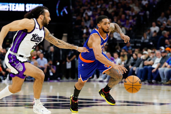 Mar 10, 2025; Sacramento, California, USA; New York Knicks guard Cameron Payne (1) dribbles the ball past Sacramento Kings guard Devin Carter (22) during the second quarter at Golden 1 Center. Mandatory Credit: Sergio Estrada-Imagn Images