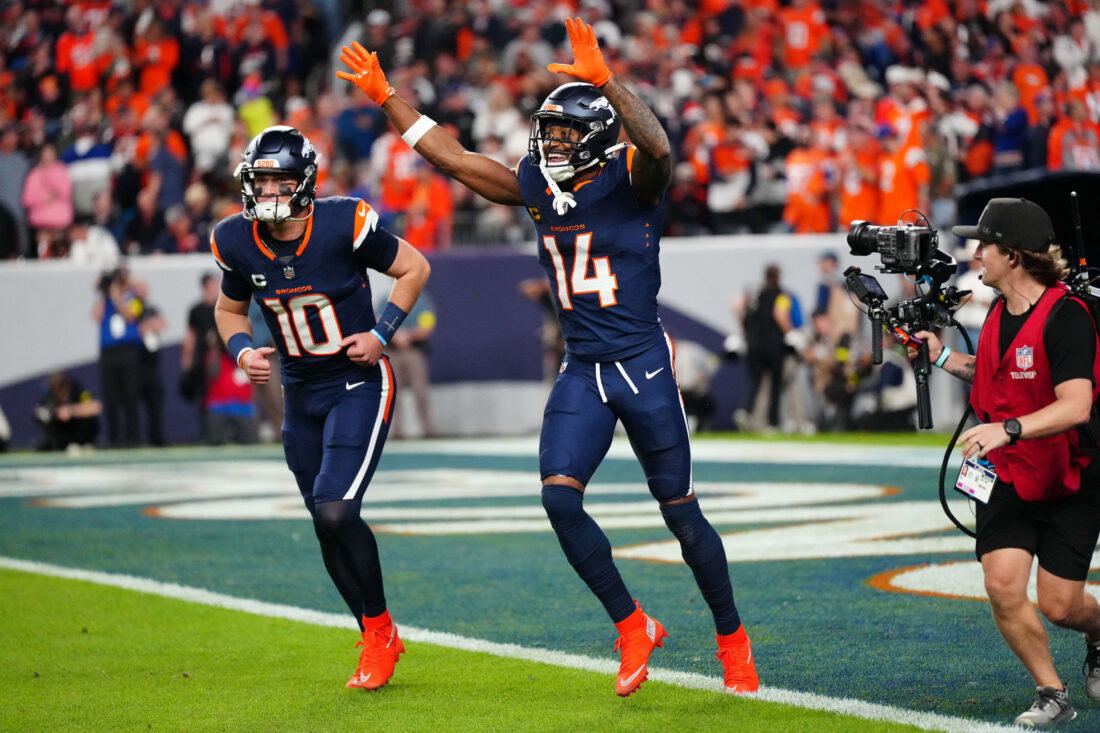 Sep 29, 2025; Denver, Colorado, USA; Denver Broncos wide receiver Courtland Sutton (14) celebrates after scoring a touchdown on a pass from Denver Broncos quarterback Bo Nix (10) during the second quarter against the Cincinnati Bengals at Empower Field at Mile High. Mandatory Credit: Ron Chenoy-Imagn Images