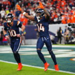 Sep 29, 2025; Denver, Colorado, USA; Denver Broncos wide receiver Courtland Sutton (14) celebrates after scoring a touchdown on a pass from Denver Broncos quarterback Bo Nix (10) during the second quarter against the Cincinnati Bengals at Empower Field at Mile High. Mandatory Credit: Ron Chenoy-Imagn Images