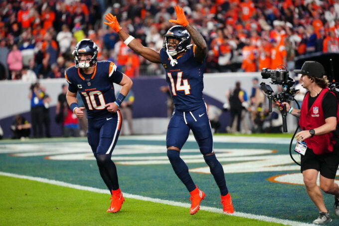 Sep 29, 2025; Denver, Colorado, USA; Denver Broncos wide receiver Courtland Sutton (14) celebrates after scoring a touchdown on a pass from Denver Broncos quarterback Bo Nix (10) during the second quarter against the Cincinnati Bengals at Empower Field at Mile High. Mandatory Credit: Ron Chenoy-Imagn Images