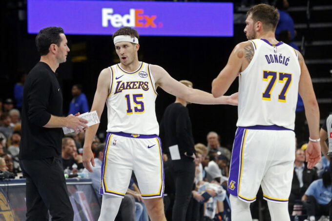 Oct 31, 2025; Memphis, Tennessee, USA; Los Angeles Lakers head coach JJ Redick talks with guard Austin Reaves (15) and guard Luka Doncic (77) during the fourth quarter against the Memphis Grizzlies at FedExForum. Mandatory Credit: Petre Thomas-Imagn Images