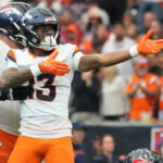 Nov 2, 2025; Houston, Texas, USA; Denver Broncos wide receiver Pat Bryant (13) celebrates after a first down during the second half against the Houston Texans at NRG Stadium. Mandatory Credit: Sean Thomas-Imagn Images
