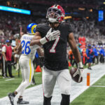 Dec 29, 2025; Atlanta, Georgia, USA; Atlanta Falcons running back Bijan Robinson (7) reacts after catching a touchdown pass against the Los Angeles Rams during the first quarter at Mercedes-Benz Stadium. Mandatory Credit: Dale Zanine-Imagn Images