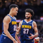 Dec 31, 2025; Toronto, Ontario, CAN; Denver Nuggets guard Jamal Murray (27) stands beside forward Spencer Jones (21) during a break in play against the Toronto Raptors during the second half at Scotiabank Arena. Mandatory Credit: Kevin Sousa-Imagn Images
