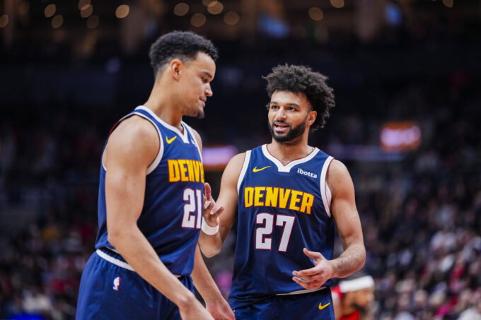 Dec 31, 2025; Toronto, Ontario, CAN; Denver Nuggets guard Jamal Murray (27) stands beside forward Spencer Jones (21) during a break in play against the Toronto Raptors during the second half at Scotiabank Arena. Mandatory Credit: Kevin Sousa-Imagn Images