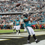 Jan 4, 2026; Jacksonville, Florida, USA; Jacksonville Jaguars running back Bhayshul Tuten (33) celebrates after scoring a rushing touchdown against the Tennessee Titans during the fourth quarter at EverBank Stadium. Mandatory Credit: Morgan Tencza-Imagn Images