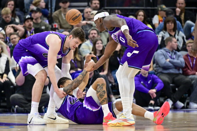 Jan 10, 2026; Salt Lake City, Utah, USA; Utah Jazz guard Keyonte George (3) is helped up after being fouled during the first half against the Charlotte Hornets at Delta Center. Mandatory Credit: Peter Creveling-Imagn Images
