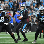 Jan 10, 2026; Charlotte, NC, USA; Carolina Panthers quarterback Bryce Young (9) looks to pass as guard Damien Lewis (68) and offensive tackle Yosh Nijman (77) block in the third quarter in an NFC Wild Card Round game at Bank of America Stadium. Mandatory Credit: Bob Donnan-Imagn Images
