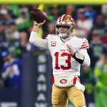 Jan 17, 2026; Seattle, WA, USA; San Francisco 49ers quarterback Brock Purdy (13) throws downfield against the Seattle Seahawks during the first half in an NFC Divisional Round game at Lumen Field. Mandatory Credit: Kevin Ng-Imagn Images