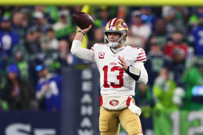 Jan 17, 2026; Seattle, WA, USA; San Francisco 49ers quarterback Brock Purdy (13) throws downfield against the Seattle Seahawks during the first half in an NFC Divisional Round game at Lumen Field. Mandatory Credit: Kevin Ng-Imagn Images