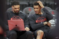 Feb 25, 2026; Houston, Texas, USA; Houston Rockets forward Jabari Smith Jr. (right) looks at a computer with assistant coach Garrett Jackson before the game against the Sacramento Kings at Toyota Center. Mandatory Credit: Troy Taormina-Imagn Images