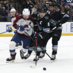 Feb 25, 2026; Salt Lake City, Utah, USA; Colorado Avalanche defenseman Devon Toews (7) and Utah Mammoth right wing Clayton Keller (9) battle for the puck during the first period at Delta Center. Mandatory Credit: Rob Gray-Imagn Images