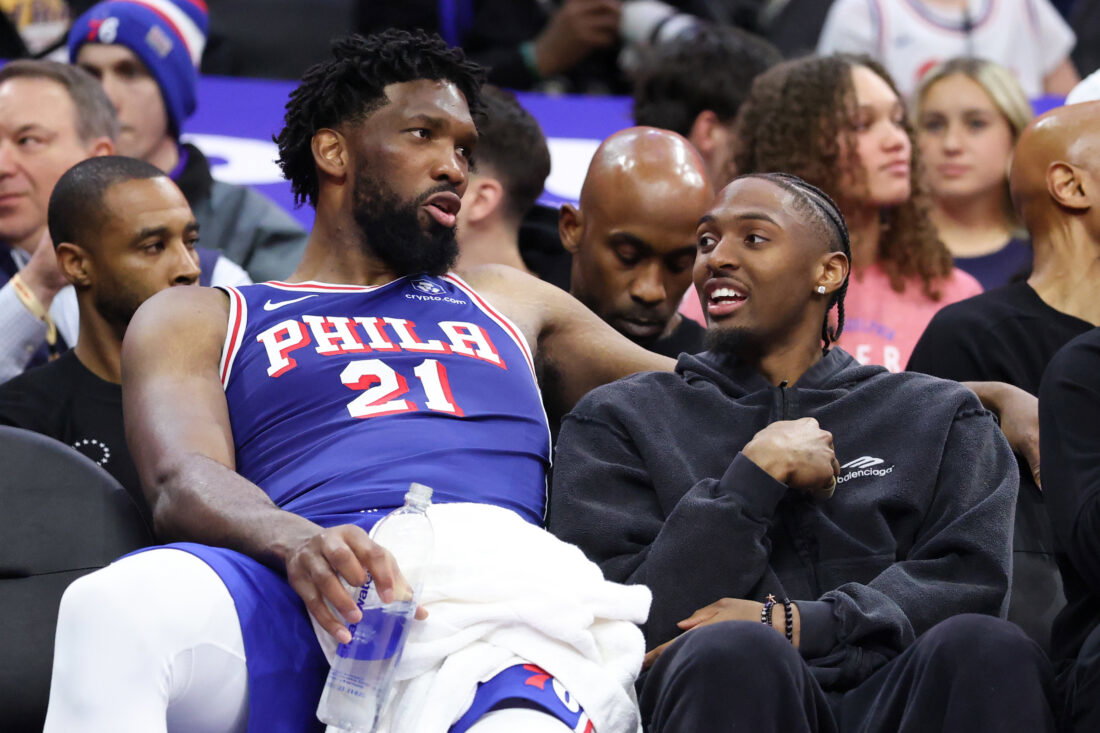 Mar 25, 2026; Philadelphia, Pennsylvania, USA; Philadelphia 76ers center Joel Embiid (21) and Tyrese Maxey (R) talk on the bench during the fourth quarter against the Chicago Bulls at Xfinity Mobile Arena. Mandatory Credit: Bill Streicher-Imagn Images