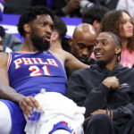 Mar 25, 2026; Philadelphia, Pennsylvania, USA; Philadelphia 76ers center Joel Embiid (21) and Tyrese Maxey (R) talk on the bench during the fourth quarter against the Chicago Bulls at Xfinity Mobile Arena. Mandatory Credit: Bill Streicher-Imagn Images