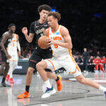 Apr 3, 2026; Brooklyn, New York, USA; Atlanta Hawks guard Dyson Daniels (5) drives the ball against Brooklyn Nets guard Nolan Traore (88) during the second half at Barclays Center. Mandatory Credit: Gregory Fisher-Imagn Images