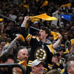 Apr 23, 2026; Boston, Massachusetts, USA; A Boston Bruins fan cheers against the Buffalo Sabres during the first period of game three of the first round of the 2026 Stanley Cup Playoffs at the TD Garden. Mandatory Credit: Brian Fluharty-Imagn Images