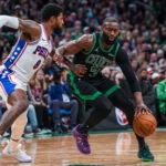Apr 28, 2026; Boston, Massachusetts, USA; Boston Celtics guard Jaylen Brown (7) drives the ball against Philadelphia 76ers forward Paul George (8) in the second half during game five of the first round of the 2026 NBA Playoffs at TD Garden. Mandatory Credit: David Butler II-Imagn Images