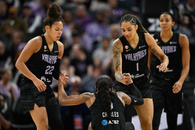 May 25, 2026; San Francisco, California, USA; Golden State Valkyries guard Veronica Burton (22) and forward Gabby Williams (1) help up guard Kaila Charles (6) against the Connecticut Sun in the second quarter at Chase Center. Mandatory Credit: Eakin Howard-Imagn Images
