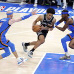 May 30, 2026; Oklahoma City, Oklahoma, USA; San Antonio Spurs guard Dylan Harper (2) controls the ball against Oklahoma City Thunder guard Shai Gilgeous-Alexander (2) and guard Alex Caruso (9) in the third quarter during game seven of the western conference finals for the 2026 NBA playoffs at Paycom Center. Mandatory Credit: Alonzo Adams-Imagn Images