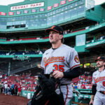 Jun 3, 2026; Boston, Massachusetts, USA; Baltimore Orioles catcher Adley Rutschman (35) and field coordinator/catching coach Joe Singley (87) walk to the bullpen before the start of the game against the Boston Red Sox at Fenway Park. Mandatory Credit: David Butler II-Imagn Images