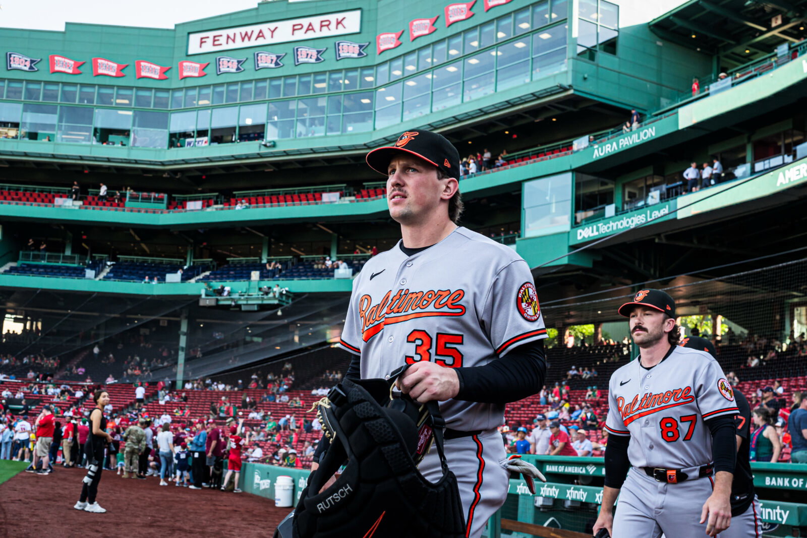 Jun 3, 2026; Boston, Massachusetts, USA; Baltimore Orioles catcher Adley Rutschman (35) and field coordinator/catching coach Joe Singley (87) walk to the bullpen before the start of the game against the Boston Red Sox at Fenway Park. Mandatory Credit: David Butler II-Imagn Images