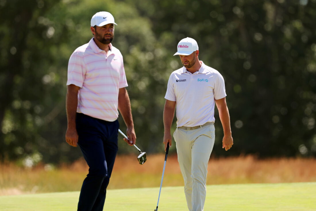 Jun 21, 2026; Southampton, New York, USA; Scottie Scheffler and Wyndham Clark setup their play on the second green during the final round of the U.S. Open golf tournament at Shinnecock Hills Golf Club. Mandatory Credit: Bill Streicher-Imagn Images