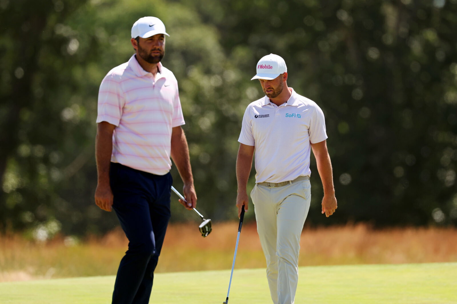 Jun 21, 2026; Southampton, New York, USA; Scottie Scheffler and Wyndham Clark setup their play on the second green during the final round of the U.S. Open golf tournament at Shinnecock Hills Golf Club. Mandatory Credit: Bill Streicher-Imagn Images