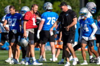Detroit Lions quarterback Jared Goff (16), left, talks to head coach Dan Campbell at practice during training camp at Meijer Performance Center in Allen Park on Wednesday, July 29, 2026.