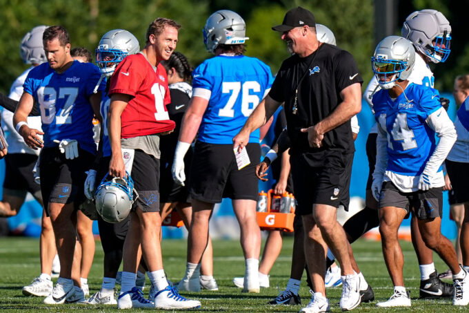 Detroit Lions quarterback Jared Goff (16), left, talks to head coach Dan Campbell at practice during training camp at Meijer Performance Center in Allen Park on Wednesday, July 29, 2026.