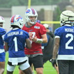 Jul 29, 2026; Rochester, NY, USA; Buffalo Bills quarterback Josh Allen (17) talks with wide receivers Mecole Hardman (1) and DJ Moore (2) during training camp at St. John Fisher University. Mandatory Credit: Mark Konezny-Imagn Images