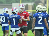 Jul 29, 2026; Rochester, NY, USA; Buffalo Bills quarterback Josh Allen (17) talks with wide receivers Mecole Hardman (1) and DJ Moore (2) during training camp at St. John Fisher University. Mandatory Credit: Mark Konezny-Imagn Images