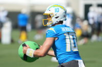 Jul 31, 2026; El Segundo, CA, USA; Los Angeles Chargers quarterback Justin Herbert (10) holds a KHAOS Water Ball during training camp at The Bolt. Mandatory Credit: Kirby Lee-Imagn Images