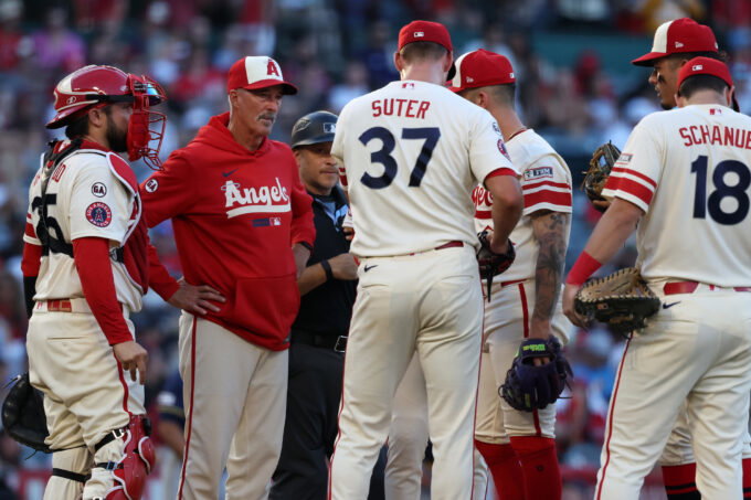Aug 1, 2026; Anaheim, California, USA; Los Angeles Angels pitching coach Mike Maddux (second from left) talks with pitcher Brent Suter (37) during a mound visit in the second inning against the Milwaukee Brewers at Angel Stadium. Mandatory Credit: Kiyoshi Mio-Imagn Images
