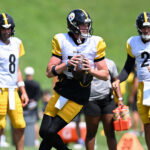 Aug 03, 2026; Latrobe, PA, USA; Pittsburgh Steelers quarterback Drew Allar (16) looks to pass as quarterbacks Aaron Rodgers (8) and Mason Rudolph (2) look on during a practice session at Training camp at Saint Vincent College. Mandatory Credit: Barry Reeger-Imagn Images