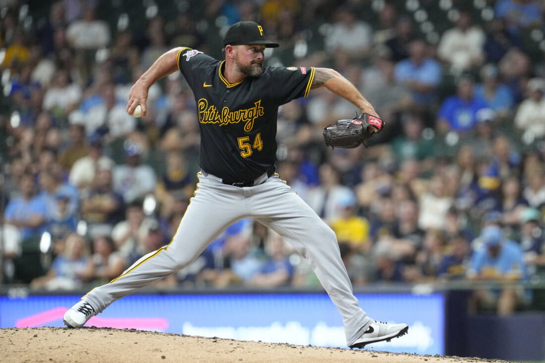 Aug 4, 2026; Milwaukee, Wisconsin, USA; Pittsburgh Pirates pitcher Kirby Yates (54) delivers a pitch against the Milwaukee Brewers in the eighth inning at American Family Field. Mandatory Credit: Michael McLoone-Imagn Images