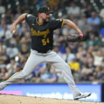 Aug 4, 2026; Milwaukee, Wisconsin, USA; Pittsburgh Pirates pitcher Kirby Yates (54) delivers a pitch against the Milwaukee Brewers in the eighth inning at American Family Field. Mandatory Credit: Michael McLoone-Imagn Images