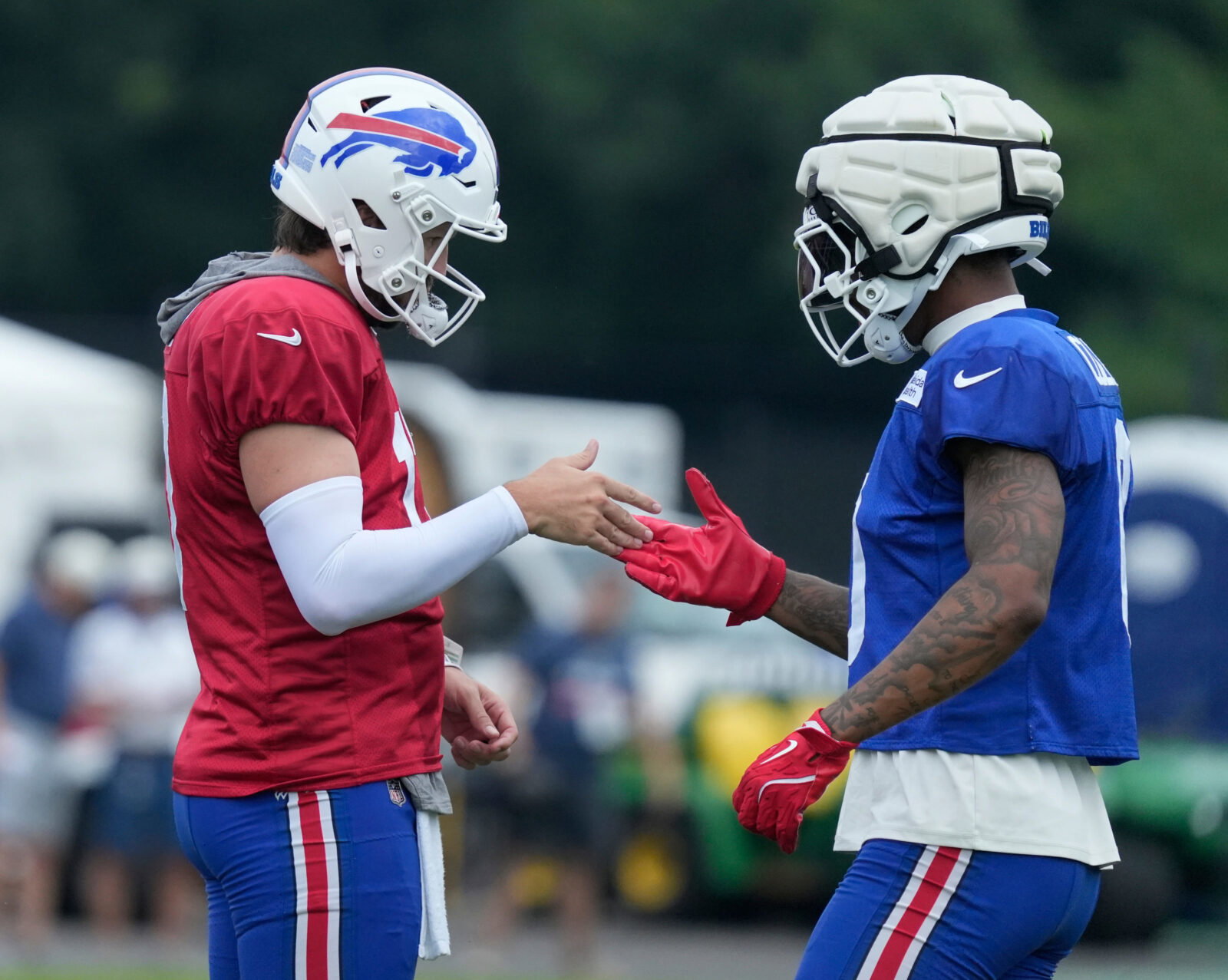 Bills quarterback Josh Allen and receiver Keon Coleman give their unique handshake between drills during the final day of Buffalo Bills training camp at St. John Fisher University Friday, August 7, 2026 in Pittsford. Credit: USA TODAY Network via Reuters Connect