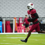 Cardinals wide receiver Marvin Harrison Jr. (18) runs after a catch during training camp at State Farm Stadium in Glendale on July 28, 2026.