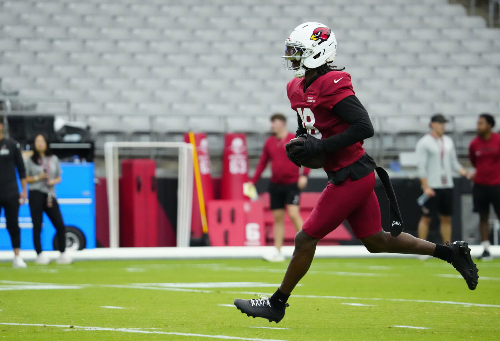 Cardinals wide receiver Marvin Harrison Jr. (18) runs after a catch during training camp at State Farm Stadium in Glendale on July 28, 2026.