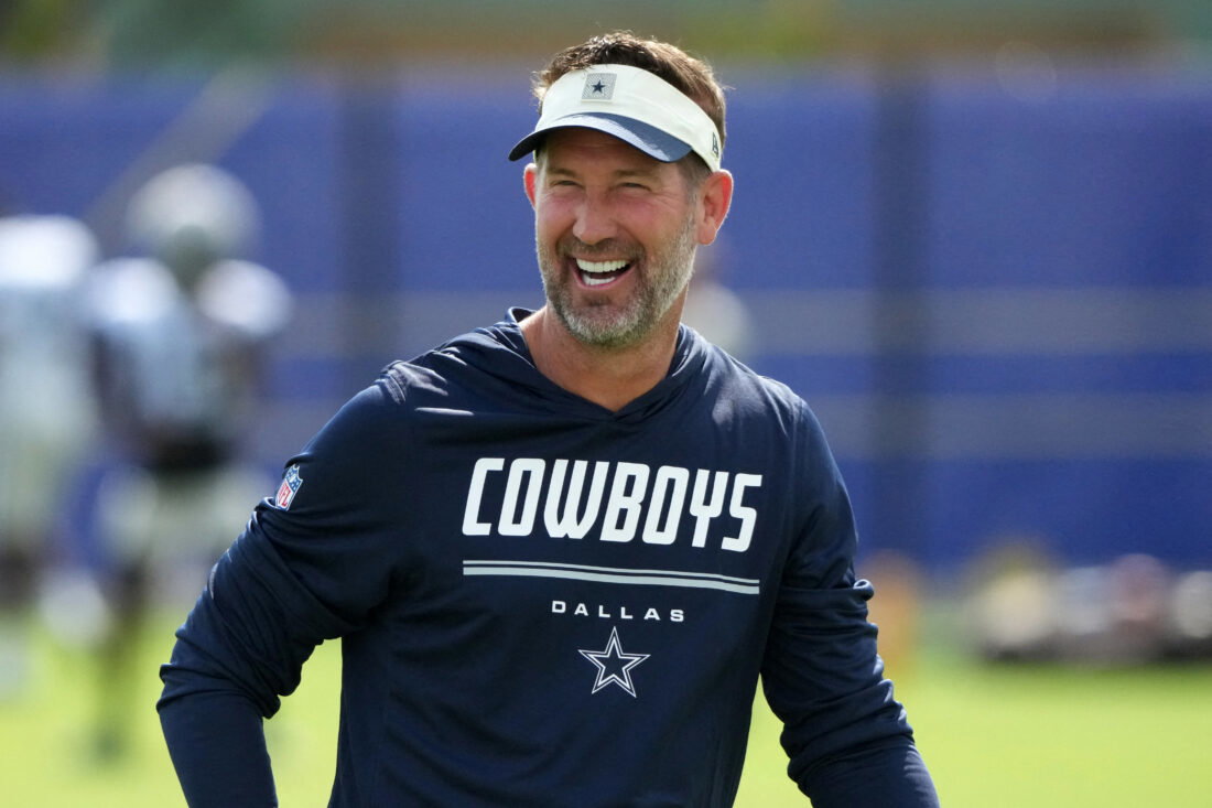 Aug 11, 2026; Woodland Hills, CA, USA; Dallas Cowboys head coach Brian Schottenheimer reacts during a joint practice against the Los Angeles Rams at the Rams Practice Facility. Mandatory Credit: Kirby Lee-Imagn Images