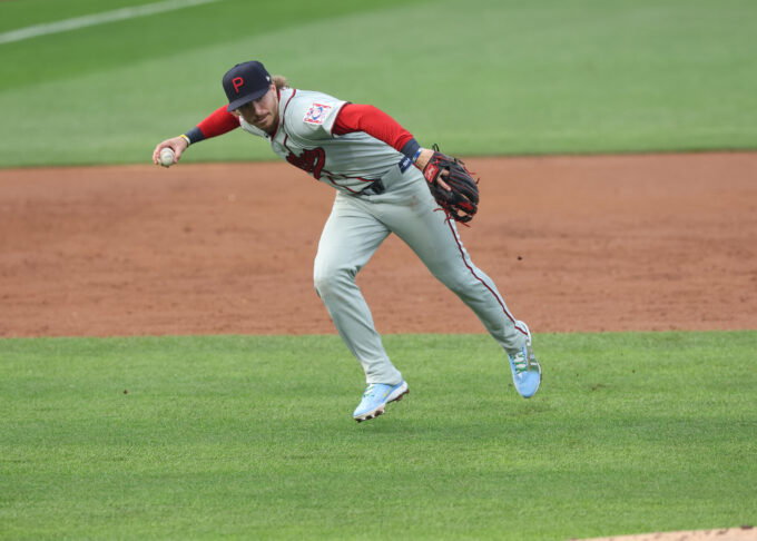 Aug 13, 2026; Dyersville, Iowa, USA; Philadelphia Phillies second baseman Bryson Stott (5) fields a ground ball against the Minnesota Twins at the Field of Dreams. Mandatory Credit: Reese Strickland-Imagn Images