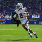 Aug 15, 2026; Orchard Park, New York, USA; Buffalo Bills wide receiver DJ Moore (2) runs with the ball after making a catch aginst the Carolina Panthers during the first half at New Highmark Stadium. Mandatory Credit: Gregory Fisher-Imagn Images
