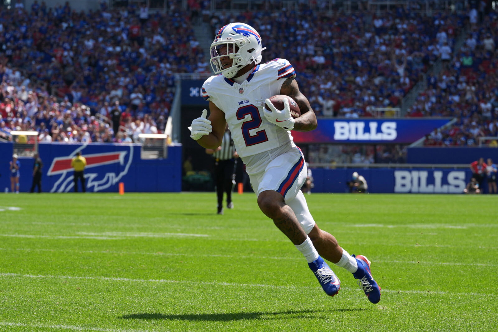 Aug 15, 2026; Orchard Park, New York, USA; Buffalo Bills wide receiver DJ Moore (2) runs with the ball after making a catch aginst the Carolina Panthers during the first half at New Highmark Stadium. Mandatory Credit: Gregory Fisher-Imagn Images