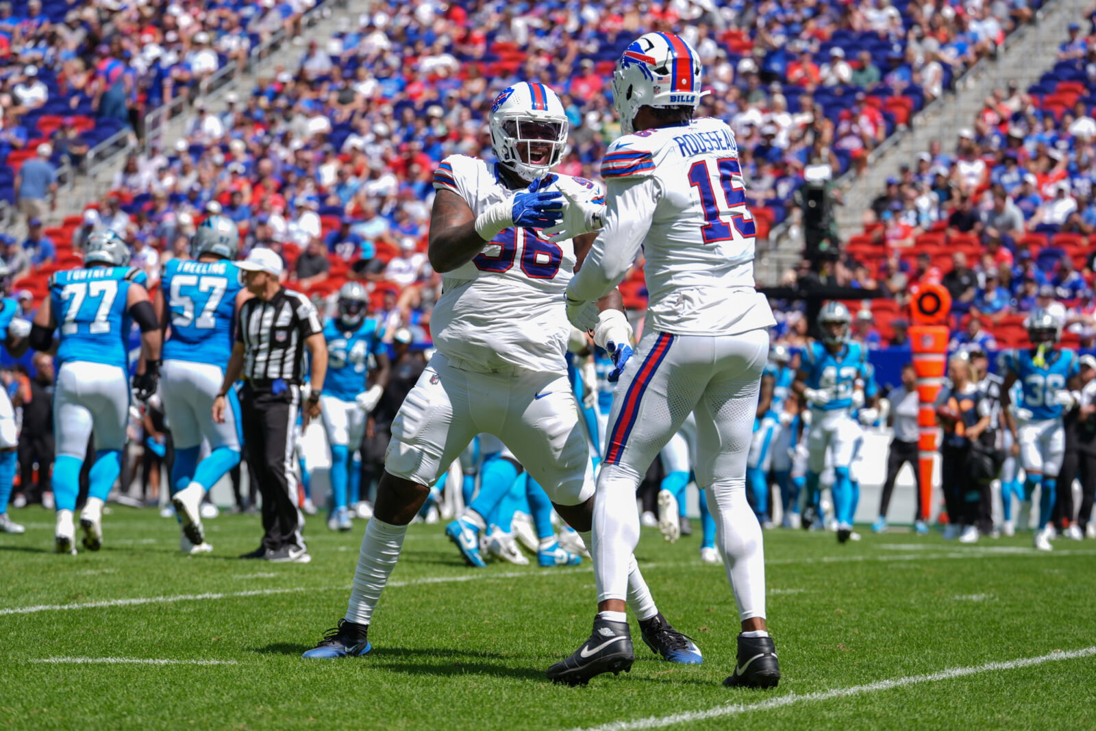 Aug 15, 2026; Orchard Park, New York, USA; Buffalo Bills defensive tackle Deone Walker (96) reacts to getting a sack with Buffalo Bills linebacker Greg Rousseau (15) during the first half at New Highmark Stadium. Mandatory Credit: Gregory Fisher-Imagn Images