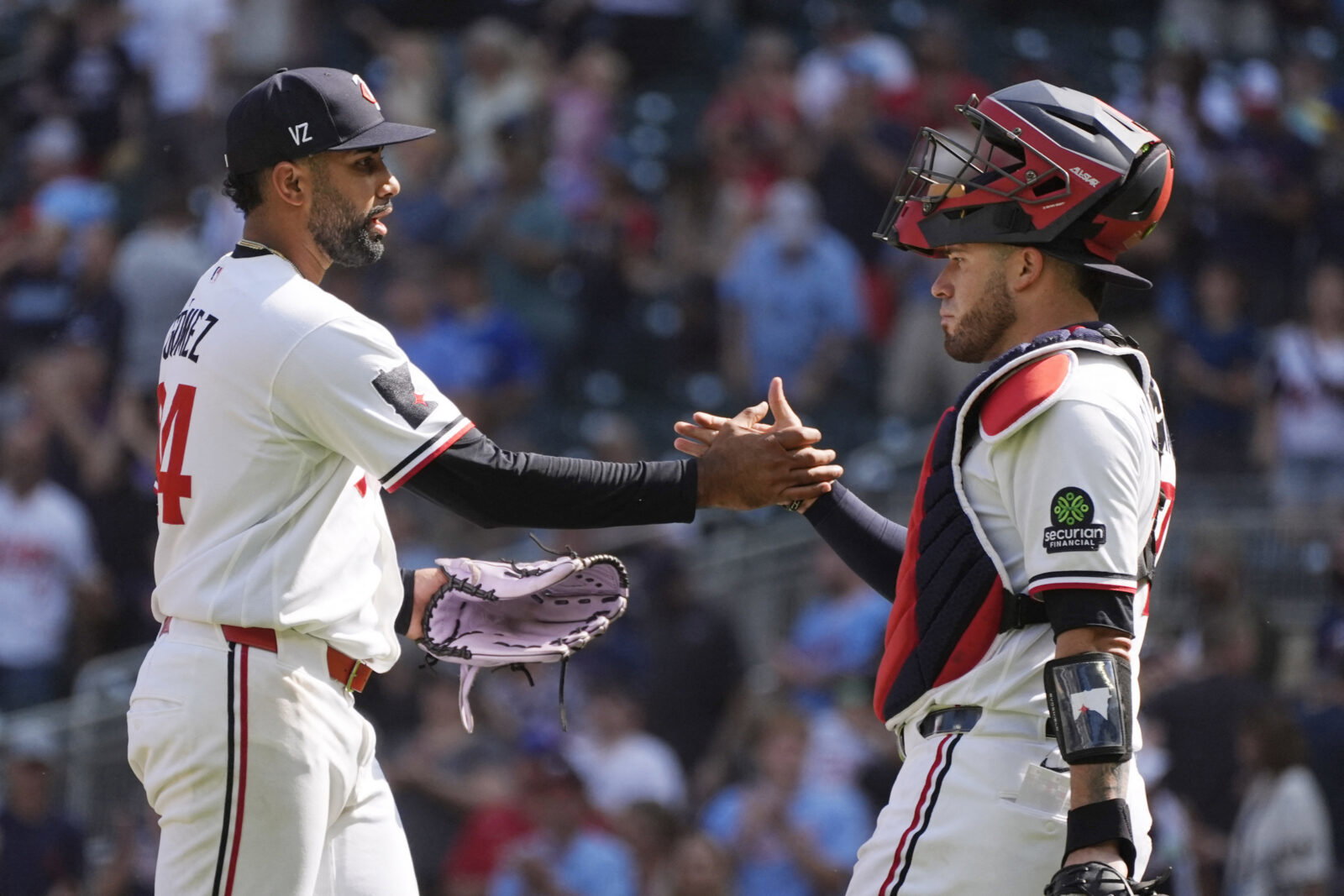 Aug 19, 2026; Minneapolis, Minnesota, USA; Minnesota Twins relief pitcher Yoendrys Gomez (94) celebrates with catcher Victor Caratini (37) the win over the Atlanta Braves after the ninth inning at Target Field. Mandatory Credit: Bruce Kluckhohn-Imagn Images