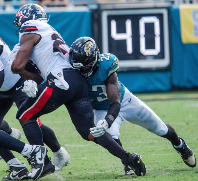 Jacksonville Jaguars linebacker Foye Oluokun (23) wraps up Houston Texans running back Nick Chubb (21) during the fourth quarter between the Houston Texans and the Jacksonville Jaguars Sunday September 21, 2025 at EverBank Stadium in Jacksonville, Fla. The Jaguars defeated the Texans 17-10. [Doug Engle/Florida Times-Union]